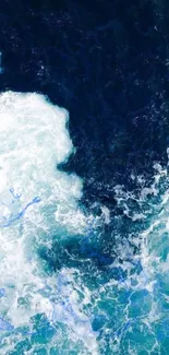 Abstract ocean wave texture wallpaper with deep blue and white colors.