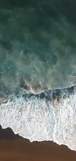 Aerial view of serene ocean waves near the shoreline.