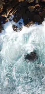 Aerial view of ocean waves crashing on rocks.