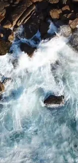 Aerial view of ocean waves crashing over rocks