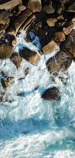 Aerial view of ocean waves crashing against rocky shore.