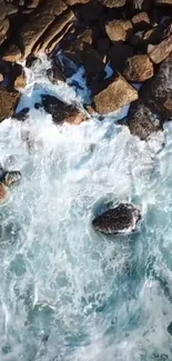 Aerial view of ocean waves hitting rocky coastline, capturing nature's power.