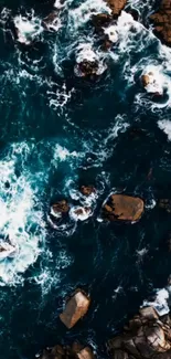 Aerial view of ocean waves crashing against rocks.