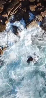 Aerial view of waves crashing on rocky coastline.