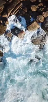 Aerial view of ocean waves crashing against rocky coastline.