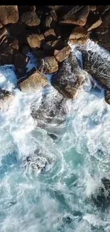 Aerial view of ocean waves crashing on rocks.