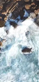 Aerial view of ocean waves crashing against rocks.