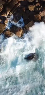 Aerial view of ocean waves crashing against rugged coastal rocks.