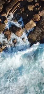 Aerial view of ocean waves crashing on rocky shore.