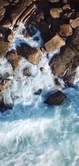 Aerial view of ocean waves crashing onto rugged rocks, creating a serene scene.