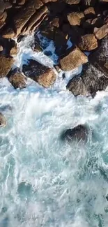 Aerial view of ocean waves crashing against rocky shore.