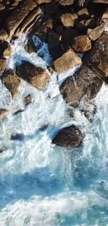 Aerial view of ocean waves crashing against rocky shore, capturing nature's raw power.