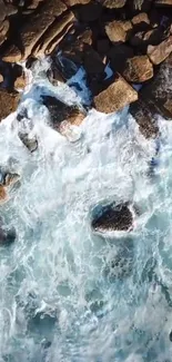 Aerial view of ocean waves crashing on rocky shore.