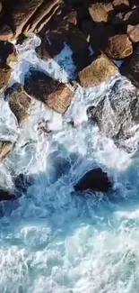 Aerial view of ocean waves crashing against rocky shore.