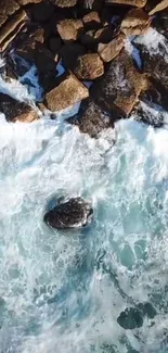 Aerial view of ocean waves crashing against a rocky shoreline.