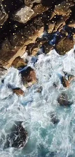 Mobile wallpaper of ocean waves crashing on a rocky shore.