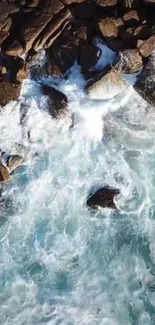 Aerial view of ocean waves crashing on a rocky shore.