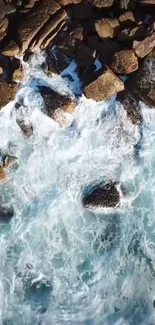 Aerial view of ocean waves hitting rocky shores.