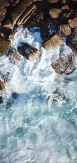 Aerial view of ocean waves crashing against rugged rocky shores.