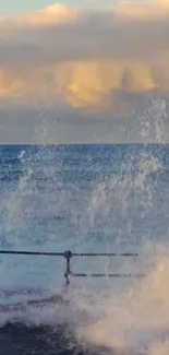 Ocean waves crashing at sunset with a dramatic sky.