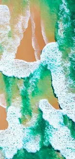 Aerial view of turquoise ocean waves meeting a golden sandy beach.