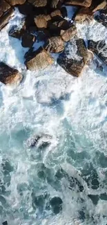 Aerial view of ocean waves crashing on rocky coastline.