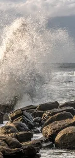 Dynamic ocean waves crash against coastal rocks under a cloudy sky.