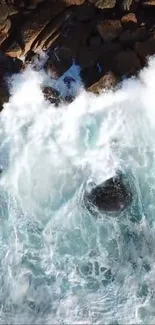 Aerial view of ocean waves crashing on rocks.