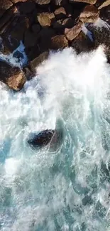 Aerial view of ocean waves crashing against rocks.