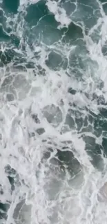 Aerial view of ocean waves with white foam.