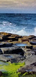 Ocean waves crash against a rocky shore with vibrant moss.