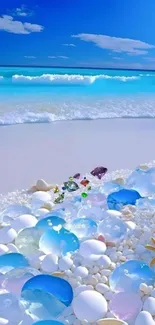 Serene beach scene with blue ocean and white sand strewn with colorful pebbles.
