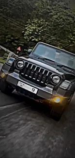 Sleek black Jeep driving on a forest road.