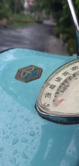 Close-up of a vintage scooter with rain droplets on a rainy day.