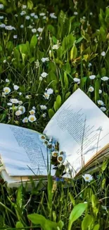 Open book on green grass with white flowers in a serene meadow setting.