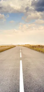 Empty road stretching under a cloudy sky with vast horizon.