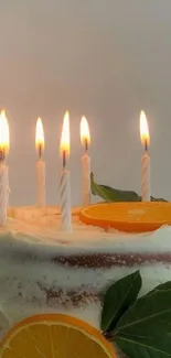 Elegant orange cake adorned with candles.