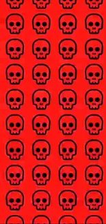 Bold red skull pattern wallpaper with black skulls for mobile phones.