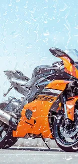 Orange motorcycle with water splash under a bright blue sky.