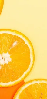 Orange slices on a yellow background mobile wallpaper.