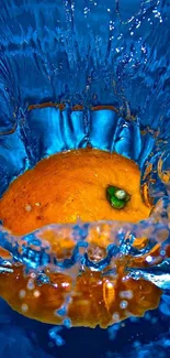 Orange fruit splashing into vivid blue water.