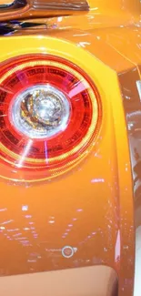 Close-up of orange sports car tail light.