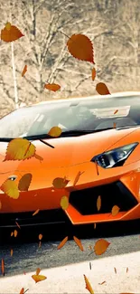 Orange sports car with autumn leaves background.