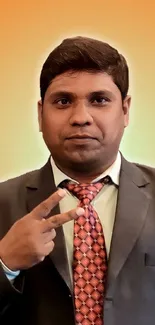 Professional portrait with orange background in a suit and tie.