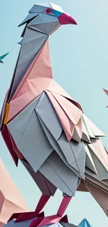 Origami birds with pastel colors against a light blue sky wallpaper.