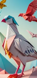 Colorful origami birds wallpaper with a sky background.