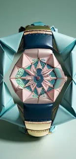 Intricate origami watch in pastel teal and pink tones.