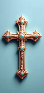 Ornate gold cross with gems on a blue background.