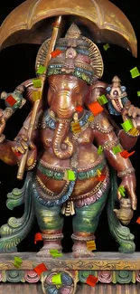 Colorful Ganesha sculpture displaying vibrant traditional artistry.