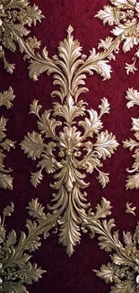 Luxurious gold pattern on deep red wallpaper.